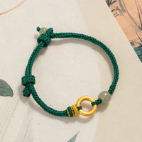 Bracelet tissé en corde verte avec perles de jade Hetian et boucle de paix en argent sterling 999 de KarmaRipple