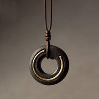 Collier pendentif Zen Circle en bois d'ébène Peace Calm de KarmaRipple