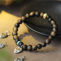 Bracelet d'équilibre et de force en bois d'agar turquoise Qinan du Vietnam de KarmaRipple