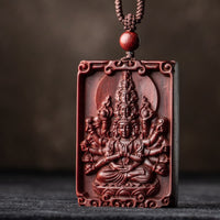 Collier avec pendentif en bois de santal rouge et petite feuille représentant le Bouddha du zodiaque chinois de KarmaRipple