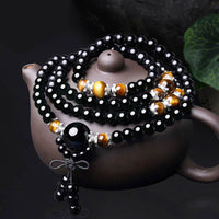 Bracelet Mala en obsidienne noire authentique œil de tigre de 108 perles de KarmaRipple