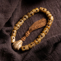 Bracelet tibétain en os de yak de KarmaRipple, le Seigneur de la forêt des cadavres, pour éloigner les mauvais esprits