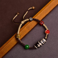 Bracelet en corde tissée de perles dzi tibétaines faites à la main par KarmaRipple