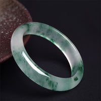 Bracelet porte-bonheur en jade authentique à fleurs flottantes de KarmaRipple