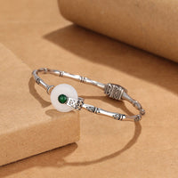 Bracelet manchette en bronze avec boucle de paix en jade ivoire de KarmaRipple, design en bambou, porte-bonheur