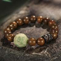 Bracelet d'équilibrage en perles de bois d'ébène PiXiu en bois de santal et graines de Bodhi de KarmaRipple