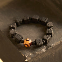 Bracelet d'équilibrage en perles de lave Dzi de KarmaRipple