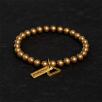Bracelet d'équilibre en perles de bronze de KarmaRipple