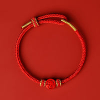 Bracelet de protection et de fortune en cinabre tissé à huit fils rouges du zodiaque chinois de KarmaRipple