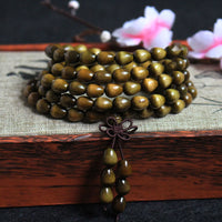 Bracelet de protection en bois authentique Phoebe Zhennan en perles de 108 Mala en forme de larme de KarmaRipple