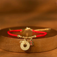 Bracelet de fortune en fil rouge avec boucle de paix en jade plaqué bronze et or de KarmaRipple, personnage Fu, année du serpent