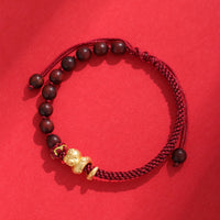 Bracelet tissé de protection en corde de coton avec perles en bois de santal rouge et ébène de KarmaRipple, année du serpent, 999