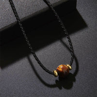 Collier avec pendentif en corde de cire de protection en perles d'œil de tigre authentiques de KarmaRipple