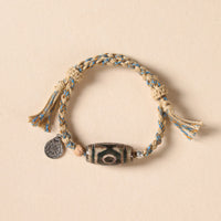 Bracelet tissé de protection de richesse en perles dzi tibétaines de KarmaRipple