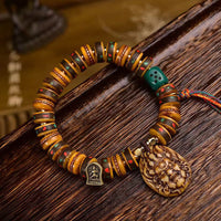 Bracelet de protection tibétain en os de chameau et pompon de KarmaRipple