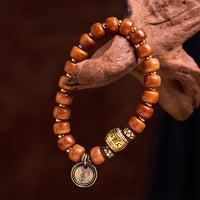 Bracelet de protection de la fortune OM sanskrit en perles de tonneau tibétain authentiques de KarmaRipple