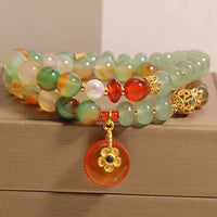 Bracelet de soutien double couche en perles et boucle de paix en agate paon colorée authentique de KarmaRipple