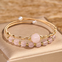 Bracelet manchette en métal équilibrant l'amour en quartz rose authentique de KarmaRipple