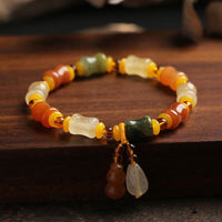 Bracelet talisman de richesse en gourde de jade et soie dorée authentique de KarmaRipple