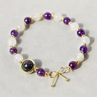 Bracelet de perles spirituelles en quartz rutile noir et améthyste œil de chat de KarmaRipple
