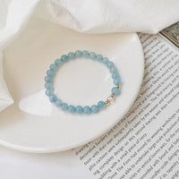 Bracelet d'équilibrage en bronze plaqué or 14 carats, aigue-marine, ivoire, agate, bleu, pierre précieuse de KarmaRipple