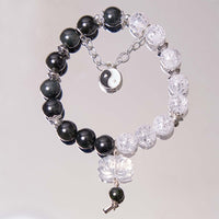 Bracelet de protection Yin Yang Lotus en quartz transparent craquelé et obsidienne argentée de KarmaRipple