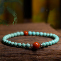 Bracelet de protection en perles d'agate rouge turquoise de KarmaRipple