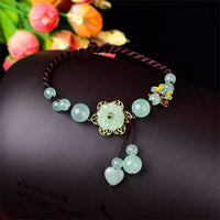 Bracelet de cheville Talisman d'abondance de fortune en forme de papillon de jade et de fleur de KarmaRipple