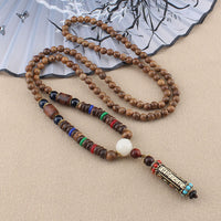 Collier avec pendentif en bois de wengé tibétain Om Mani Padme Hum Dzi de KarmaRipple