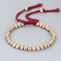 Bracelet porte-bonheur tibétain en perles de bronze fait main de KarmaRipple