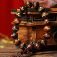 Bracelet de guérison gravé du Sutra du cœur en bois de rose tibétain de KarmaRipple