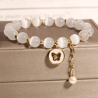 Bracelet d'amour talisman papillon œil de chat de KarmaRipple