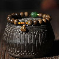 Bracelet KarmaRipple en or 999, bois d'agar de Brunei, jade cyan, fleur de lotus, paix et force