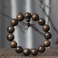 Bracelet de bénédiction spirituelle en bois rare de Phoebe Zhennan de KarmaRipple