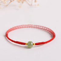 Bracelet tissé en perles de jade porte-bonheur fait main de KarmaRipple
