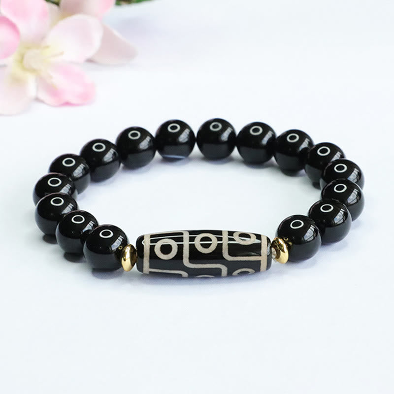 KarmaRipple's Tibetan Nine-Eye Dzi Bead Black Onyx Power Bracelet p1