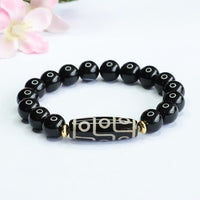 Bracelet de pouvoir tibétain en onyx noir avec perles dzi à neuf yeux de KarmaRipple