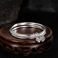 Bracelet jonc en bronze ivoire avec fleur de lotus de KarmaRipple, nouveau départ