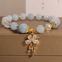 Bracelet Talisman Papillon Équilibrant en Zircon et Pierres Précieuses Roses Aigue-Marine de KarmaRipple