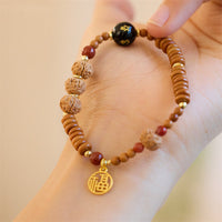 Bracelet tibétain Bodhi Seed, onyx noir, quartz fumé, symbole Om Mani Padme Hum Fu, de KarmaRipple