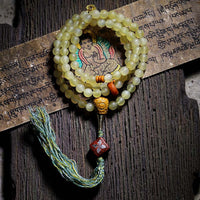 Bracelet porte-bonheur en ambre et corne de mouton du Tibet, 108 perles Mala de KarmaRipple