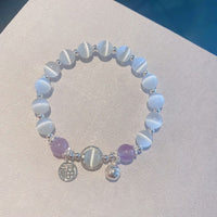 Bracelet de soutien talisman cloche en améthyste œil de chat de KarmaRipple