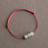 Bracelet tissé en fil de jade à trois perles de KarmaRipple
