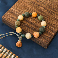 Bracelet Paix et Calme en Perles de Lotus Bodhi de KarmaRipple gravées en Agate Mousse