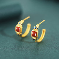 Boucles d'oreilles à tige en argent sterling 925 et agate rouge Lotus de KarmaRipple