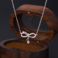 Collier pendentif de protection en argent sterling 999 de KarmaRipple, pendentif en forme de queue tissée sans fin de l'année du dragon