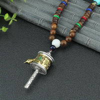 Collier pendentif en bois de vajra tibétain avec roue de prière rotative Om Mani Padme Hum de KarmaRipple