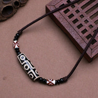 Pendentif de protection en perles dzi tibétaines à neuf yeux de KarmaRipple