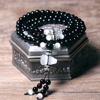 Bracelet de méditation en perles d'onyx noir et ivoire de KarmaRipple