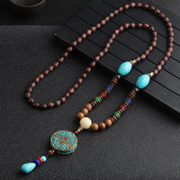 Pendentif de méditation en bois de wengé avec roue de prière en perles turquoise Dzi de KarmaRipple